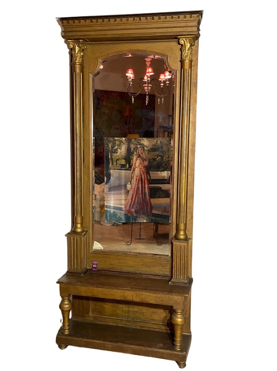 The pieces include a grand gold mirror and a painting of Kirstie