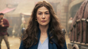 The Wheel of Time's Moiraine walks down a street in Fal Dara, Rosamund Pike has joined  the cast of Now You See Me 3