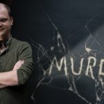 Director Mike Flanagan against the Murder chalkboard in Doctor Sleep.