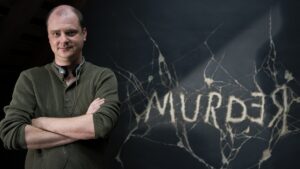 Director Mike Flanagan against the Murder chalkboard in Doctor Sleep.