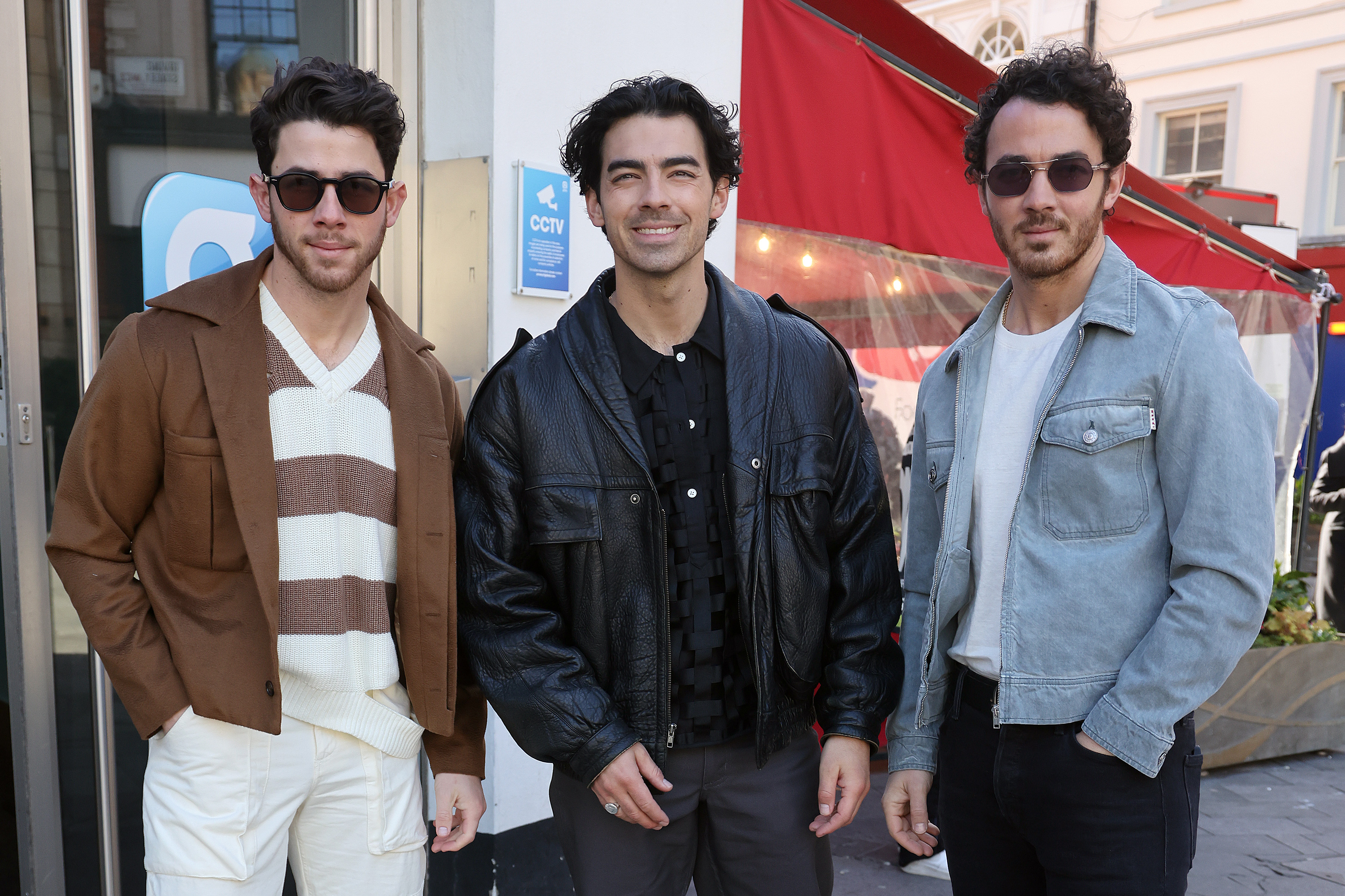 Nick pictured with his brothers Joe and Kevin Jonas in 2023