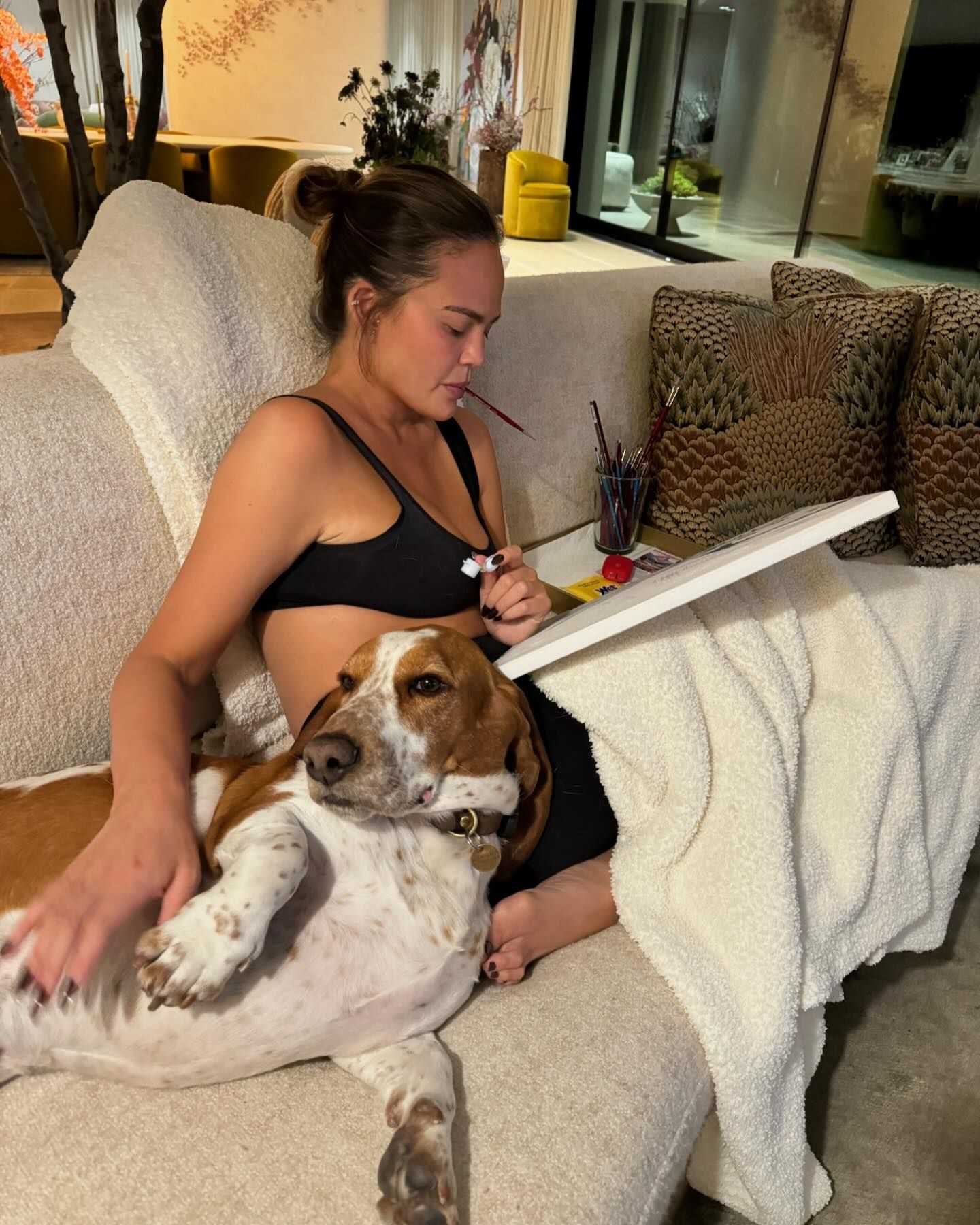 Chrissy shared a peek into her home life as she sat on the sofa with one of her pet companions