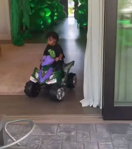 Kim filmed her tiny tot riding his brand new mini four-wheeler through the house