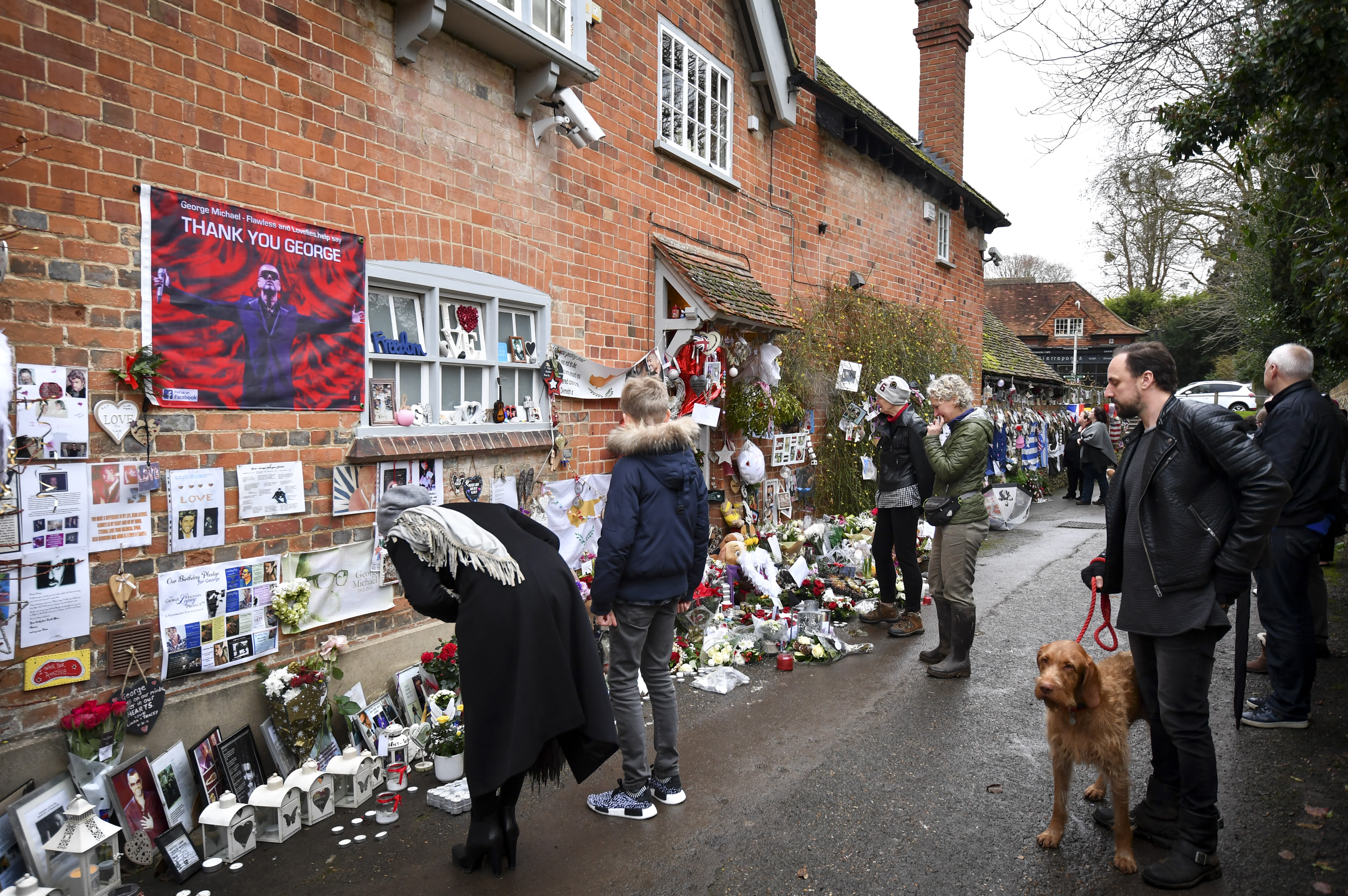 Well-wishers gathered outside the home and left hundreds of tributes following his death