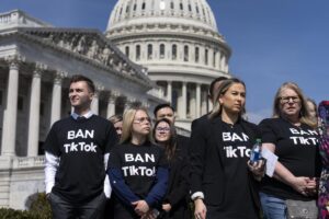 People calling for the banning of TikTok attend a news conference at the Capitol.