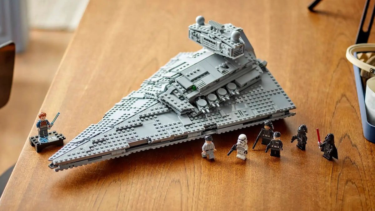 LEGO Imperial Star Destroyer on a table built with minifigs in front