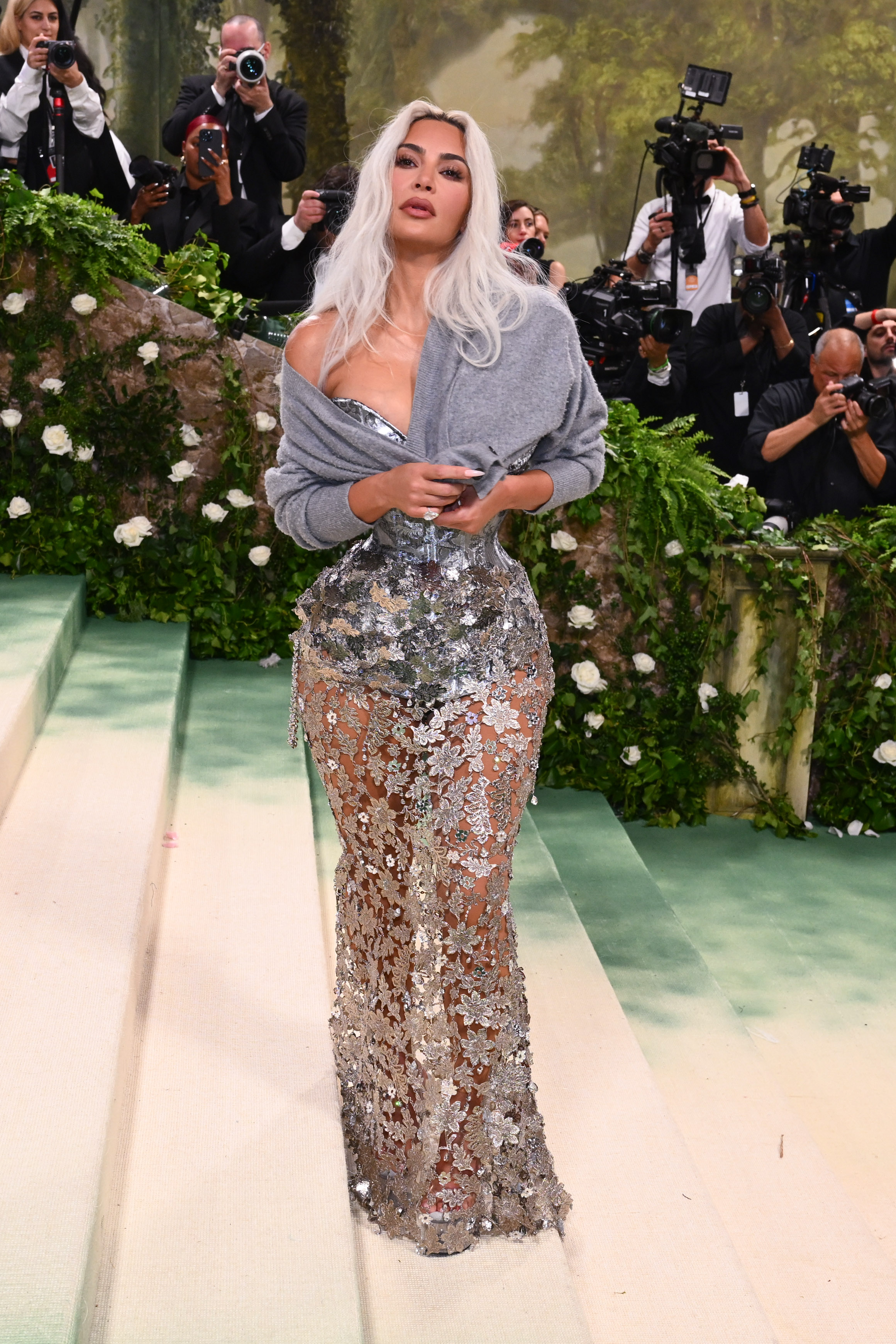 The reality star stuck to the Garden of Time theme in the silver corseted look that cinched her tiny waist to the extreme