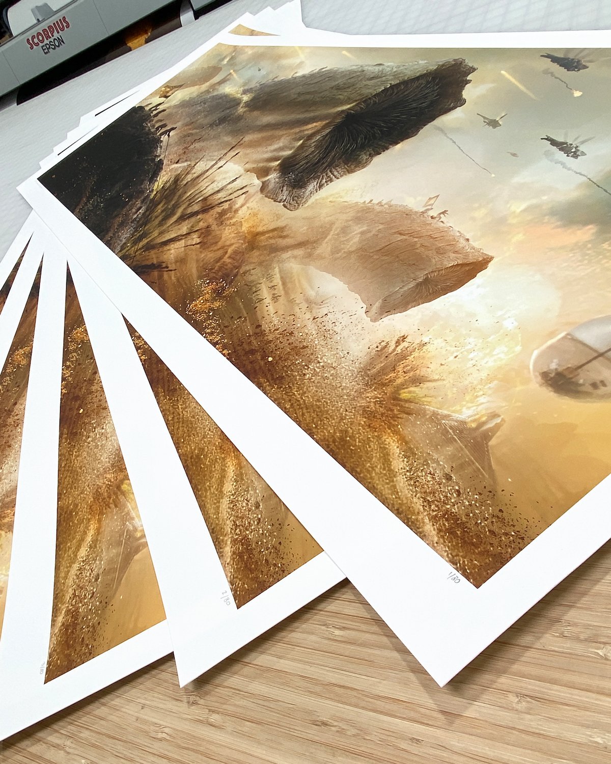 Multiple copies of Mutant's giant Dune: Part Two poster showing a Fremen sandworm attack piled on one another to show just one detail