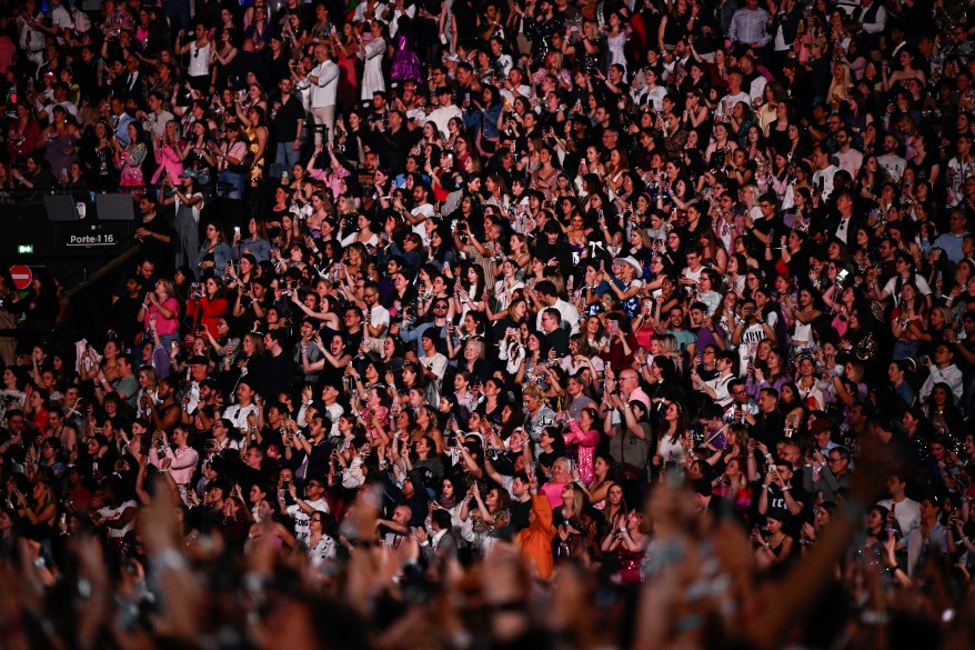 Fans cheer as Taylor Swift performs The Eras Tour in Paris, France.