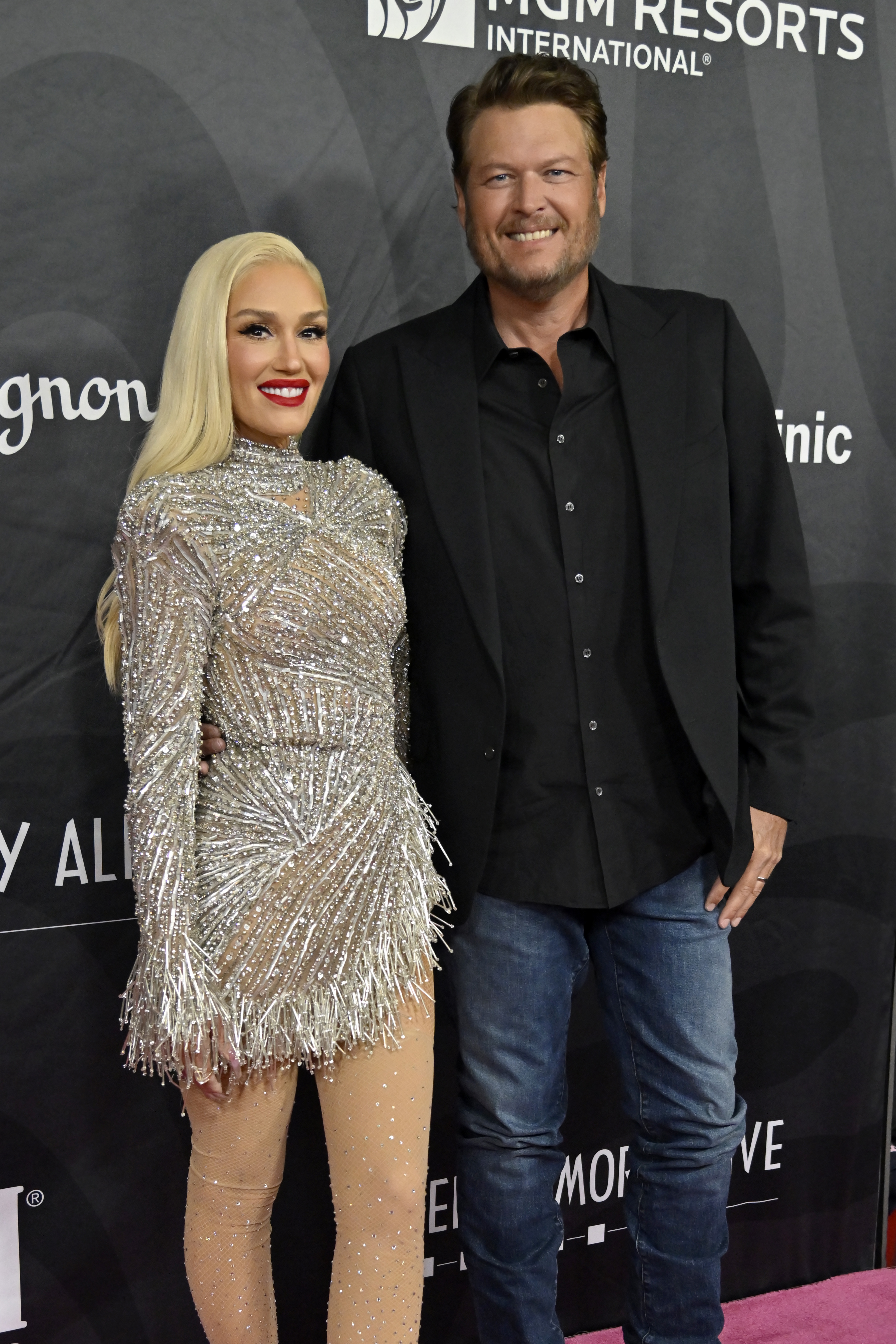 The No Doubt frontwoman dazzled in a short silver dress while Blake looked classy in a dark suit jacket, shirt, and blue jeans combo
