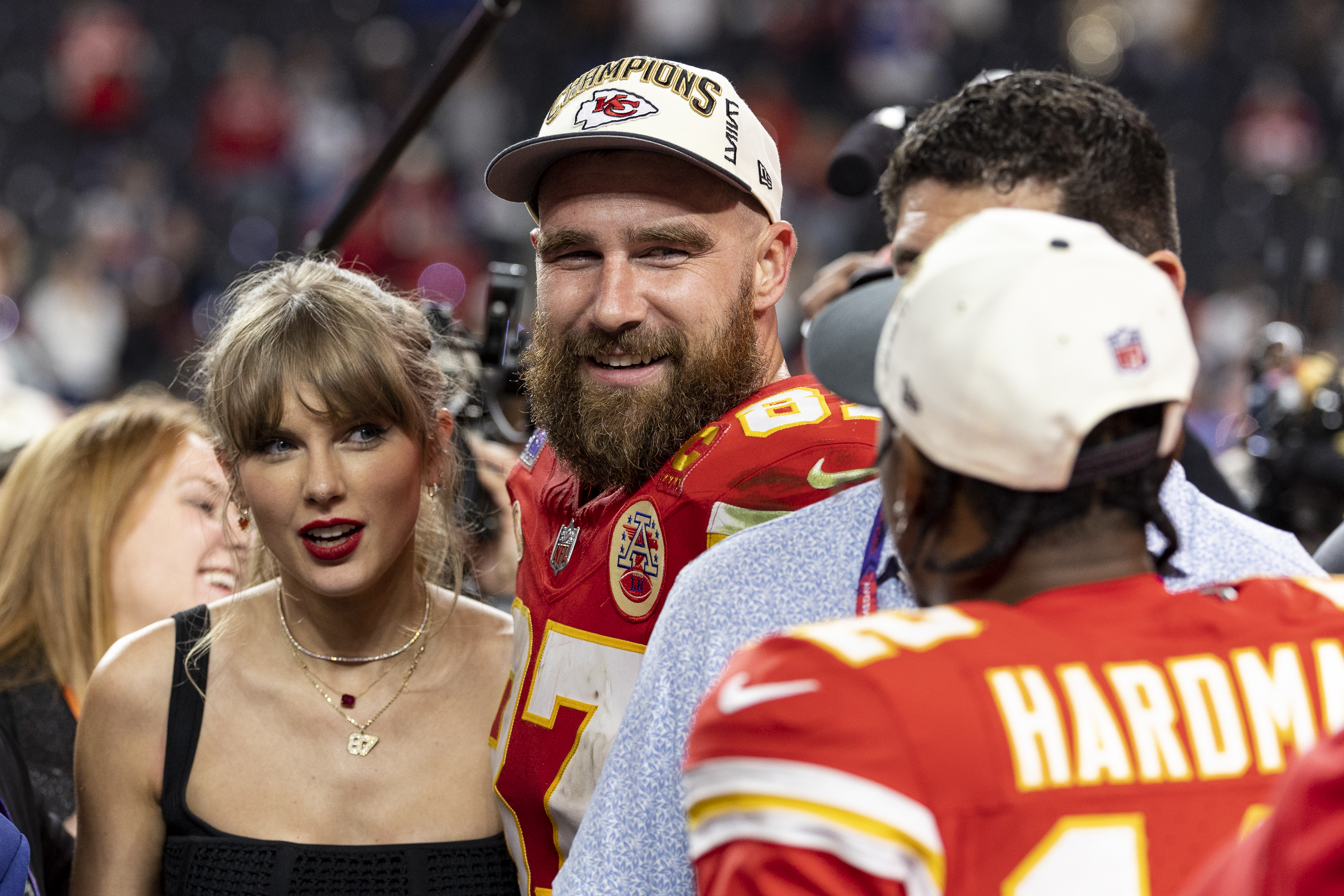 The Kansas City Chiefs colors, which Travis plays on, are red and yellow, the same color as Taylor's new bodysuit