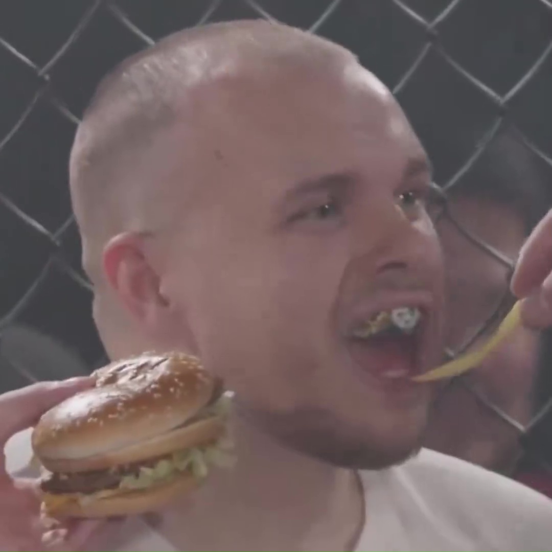 Content creator Popo is fed chips and a burger in between rounds