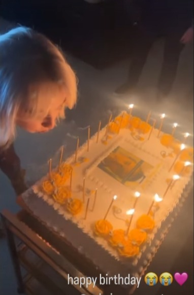 Sabrina blowing out her Leo cake