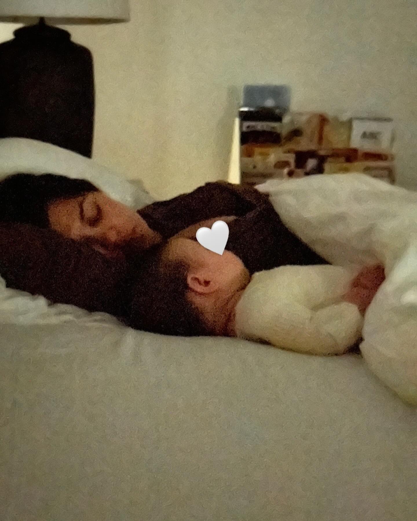 She was seen snoozing with the six-month-old in one sweet photo