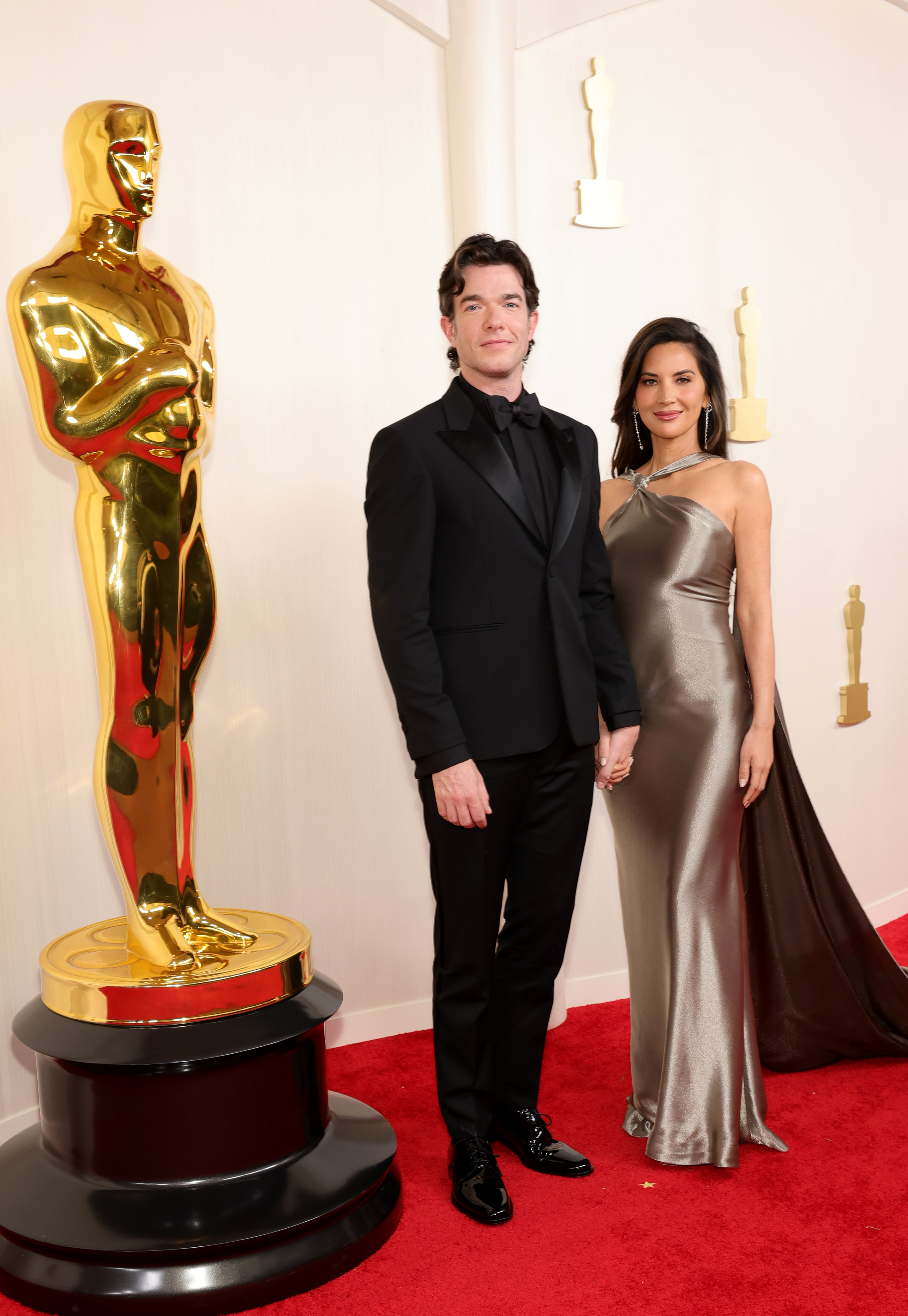 Olivia Munn and John Mulaney pictured together at the 2024 Oscars
