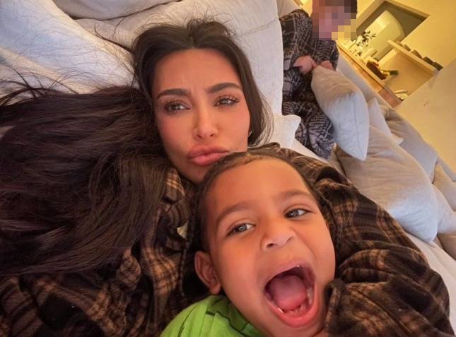 Kim, 43, displayed her fine lines and pimples in a photo with her son Psalm, five
