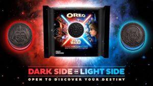 A box of Oreo Star Wars cookies with character art on the package and red and blue lit cookies on the outside above writing