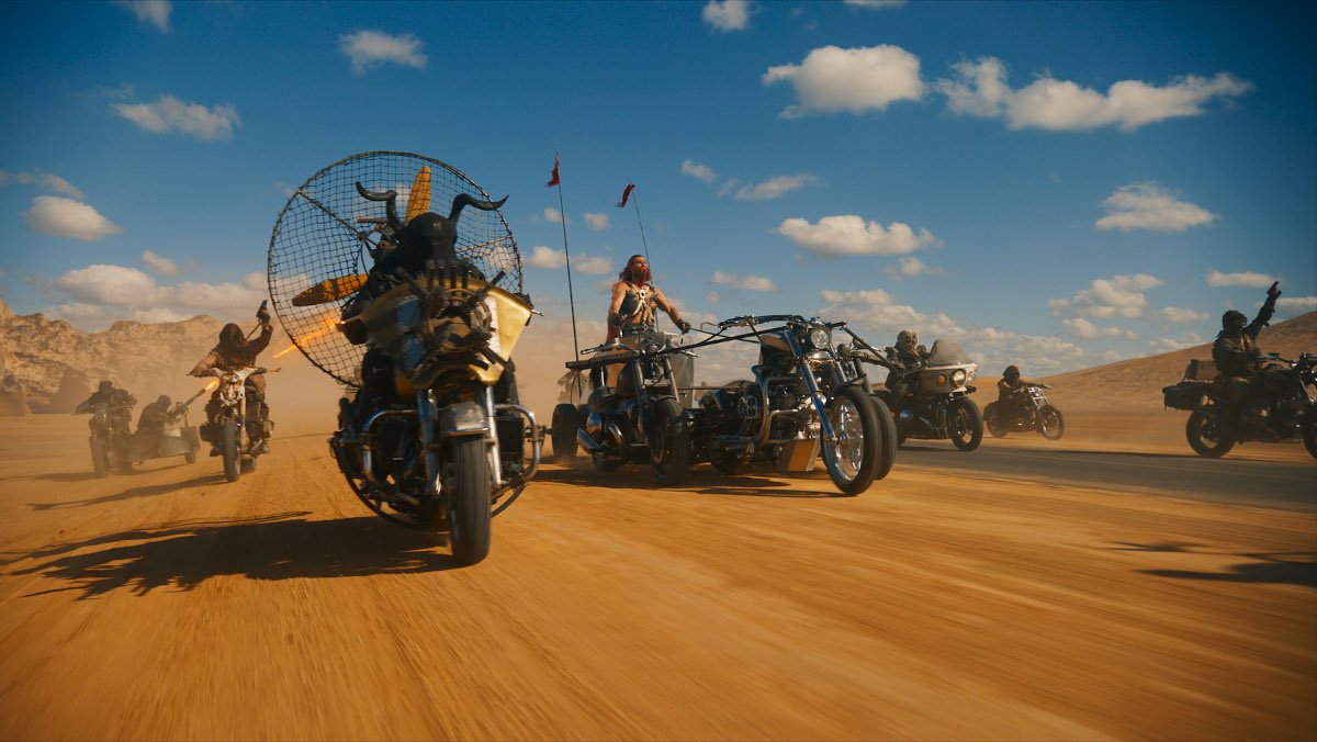 A horde of bikes travel across the desert in a Mad Max spinoff