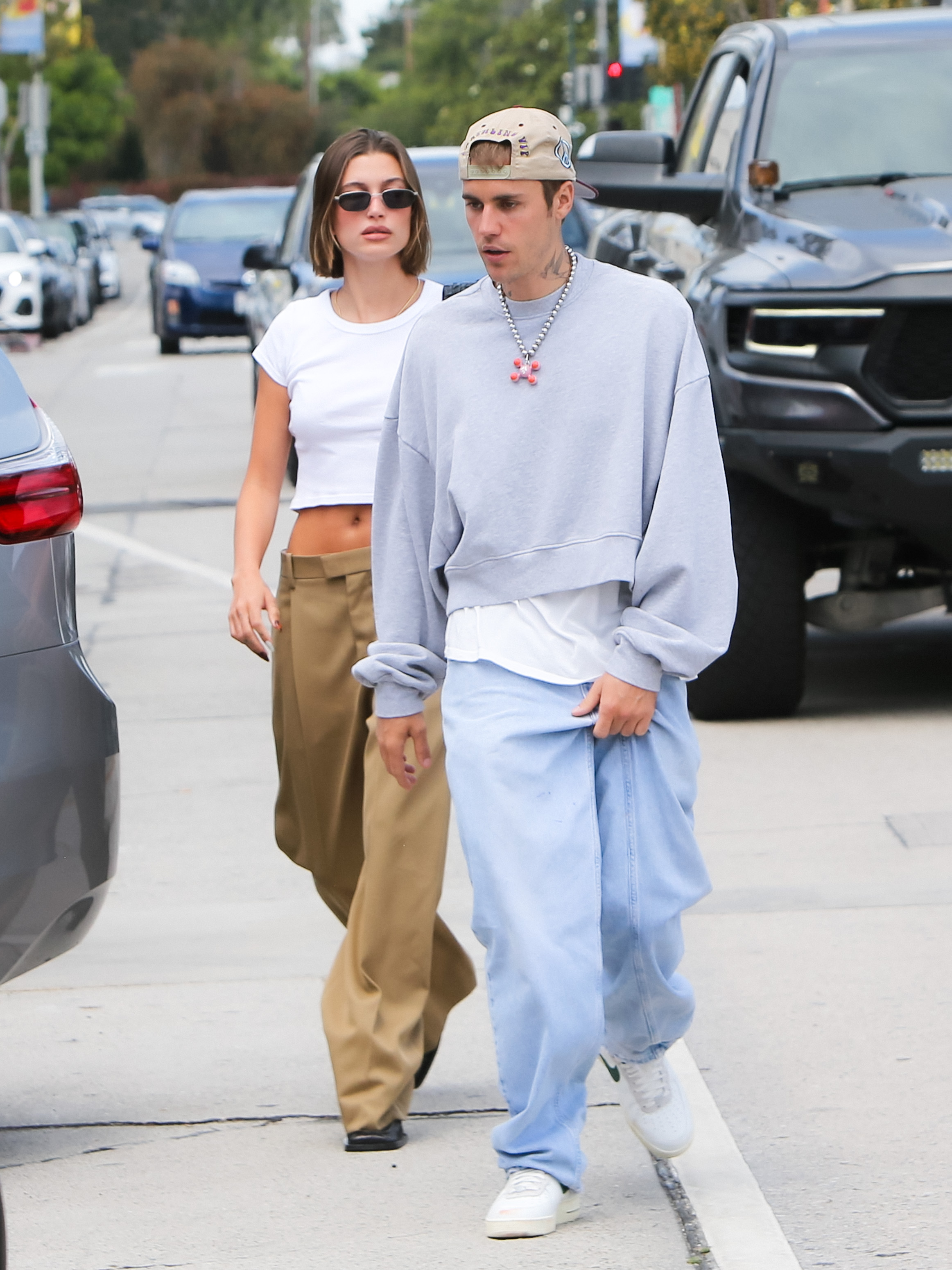 Above, the couple were spotted in LA as Hailey wore a cropped top and pants while Justin wore a pullover and jeans