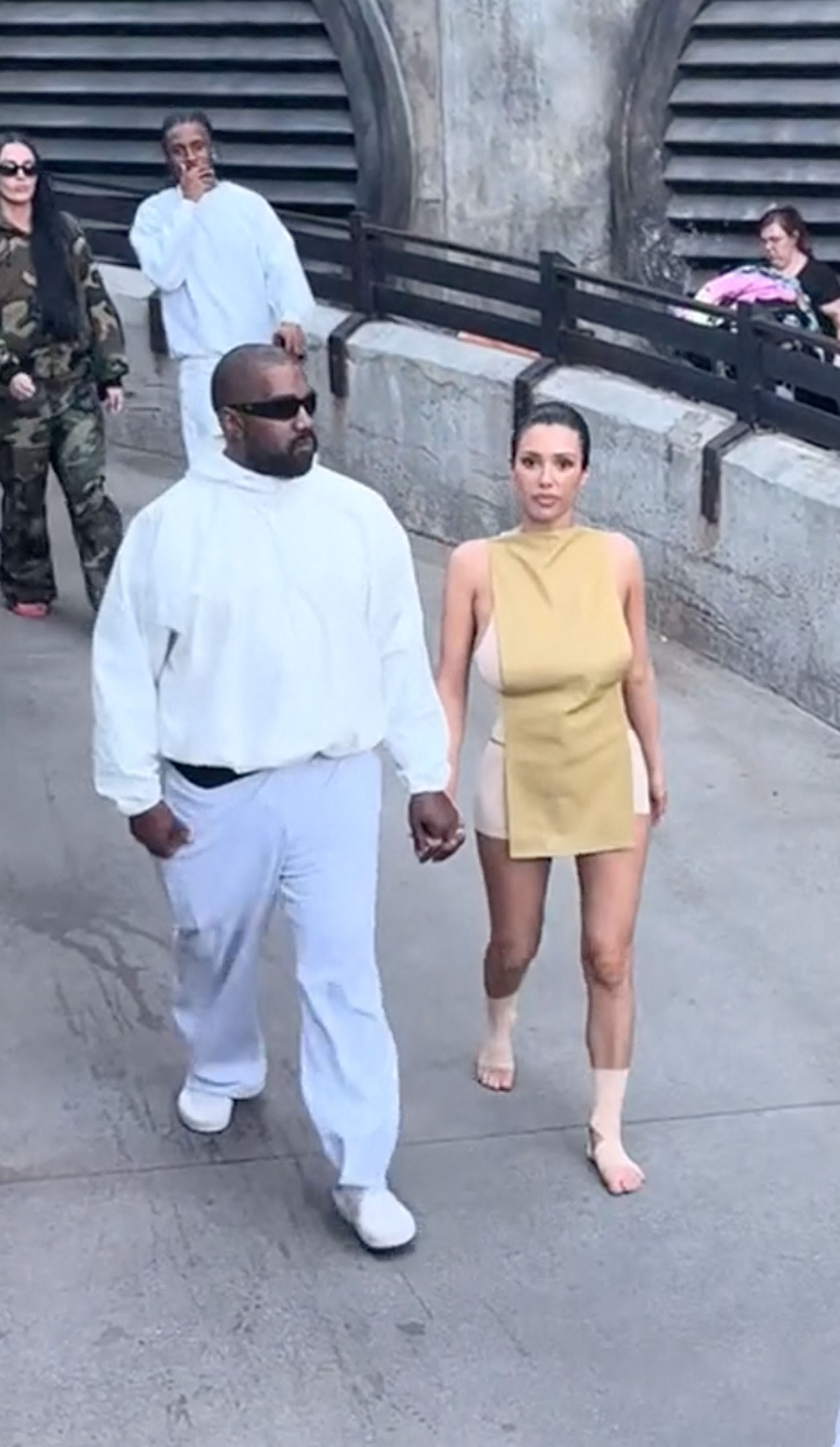Kanye West and his wife Bianca Censori pictured during their public stroll in April 2024