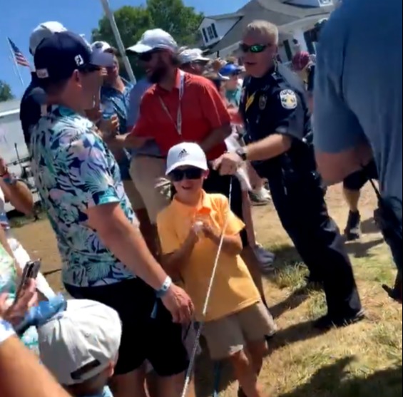 The kid was ecstatic after being gifted DeChambeau's match ball