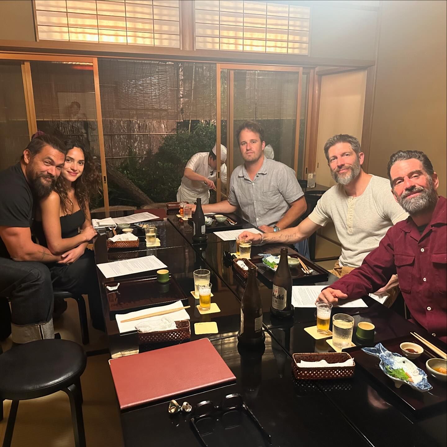 Jason Momoa and Adria Arjona pictured with a group of friends