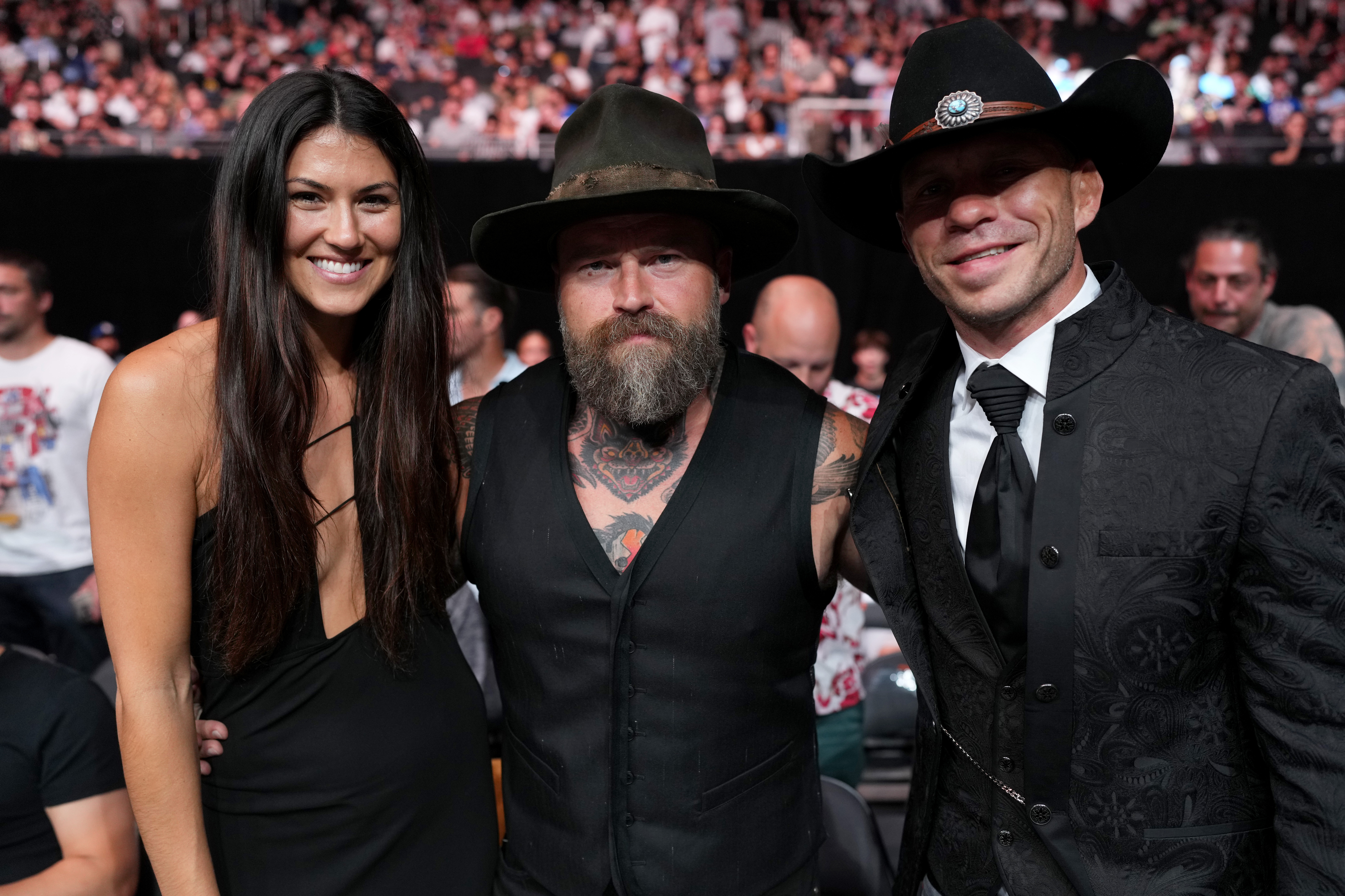 AUSTIN, TEXAS – JUNE 18: Recording artist Zac Brown (C) of the Zac Brown Band is seen in attendance with a guest and Donald “Cowboy” Cerrone (R) during the UFC Fight Night event at Moody Center on June 18, 2022 in Austin, Texas. (Photo by Cooper Neill/Zuffa LLC)