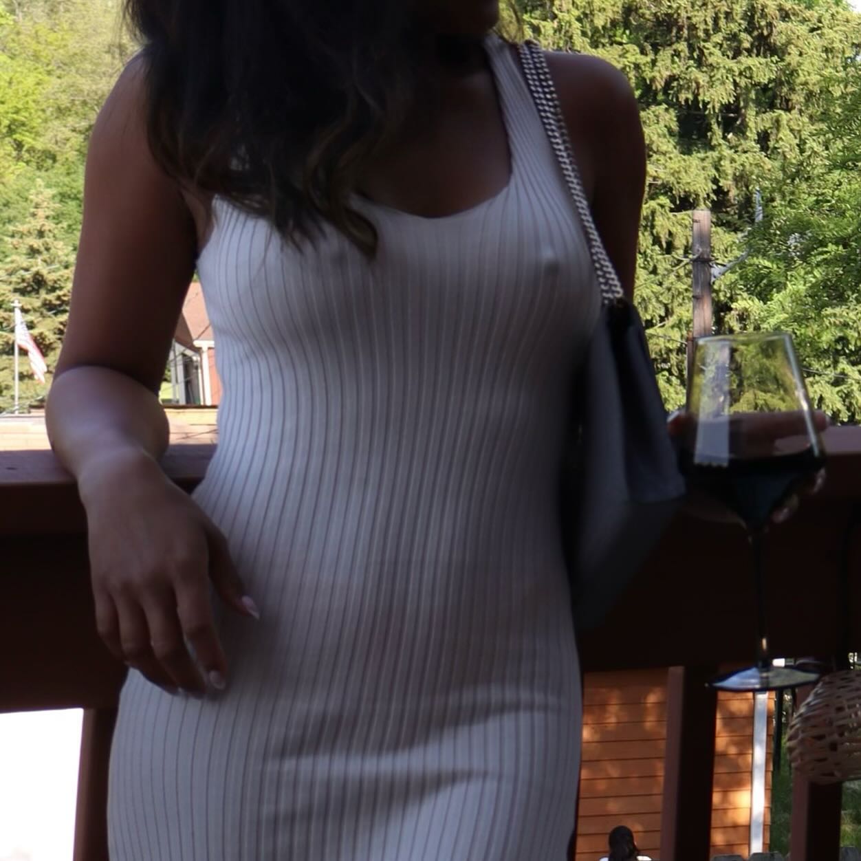 She posed in a tight white dress which showed off her nipples