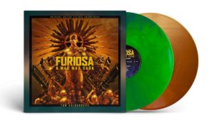 The cover of the Furiosa soundtrack with her in gold with a green and a brown vinyl record coming out of the side