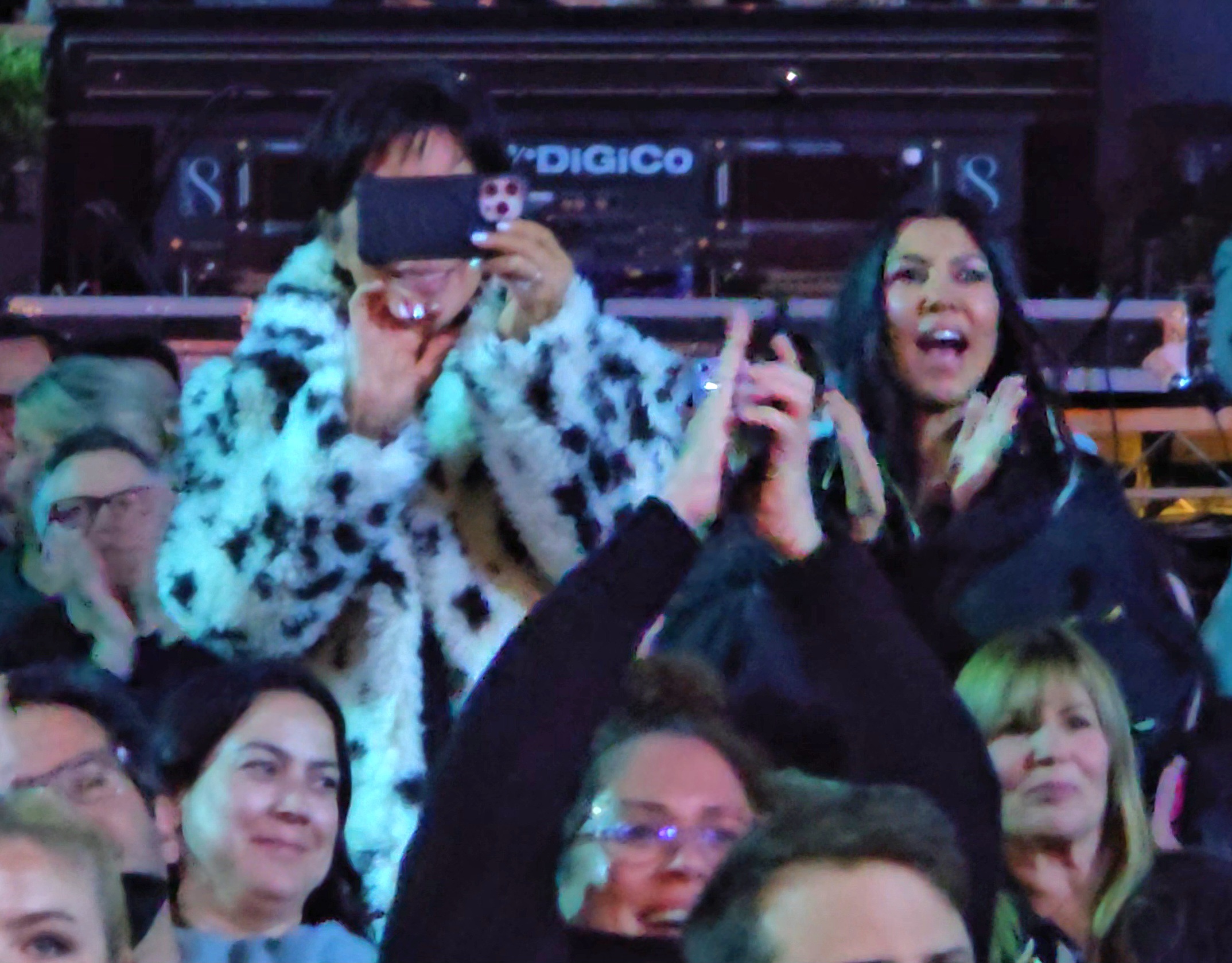 Kris Jenner smiled as she held her phone aloft to capture her granddaughter's big moment