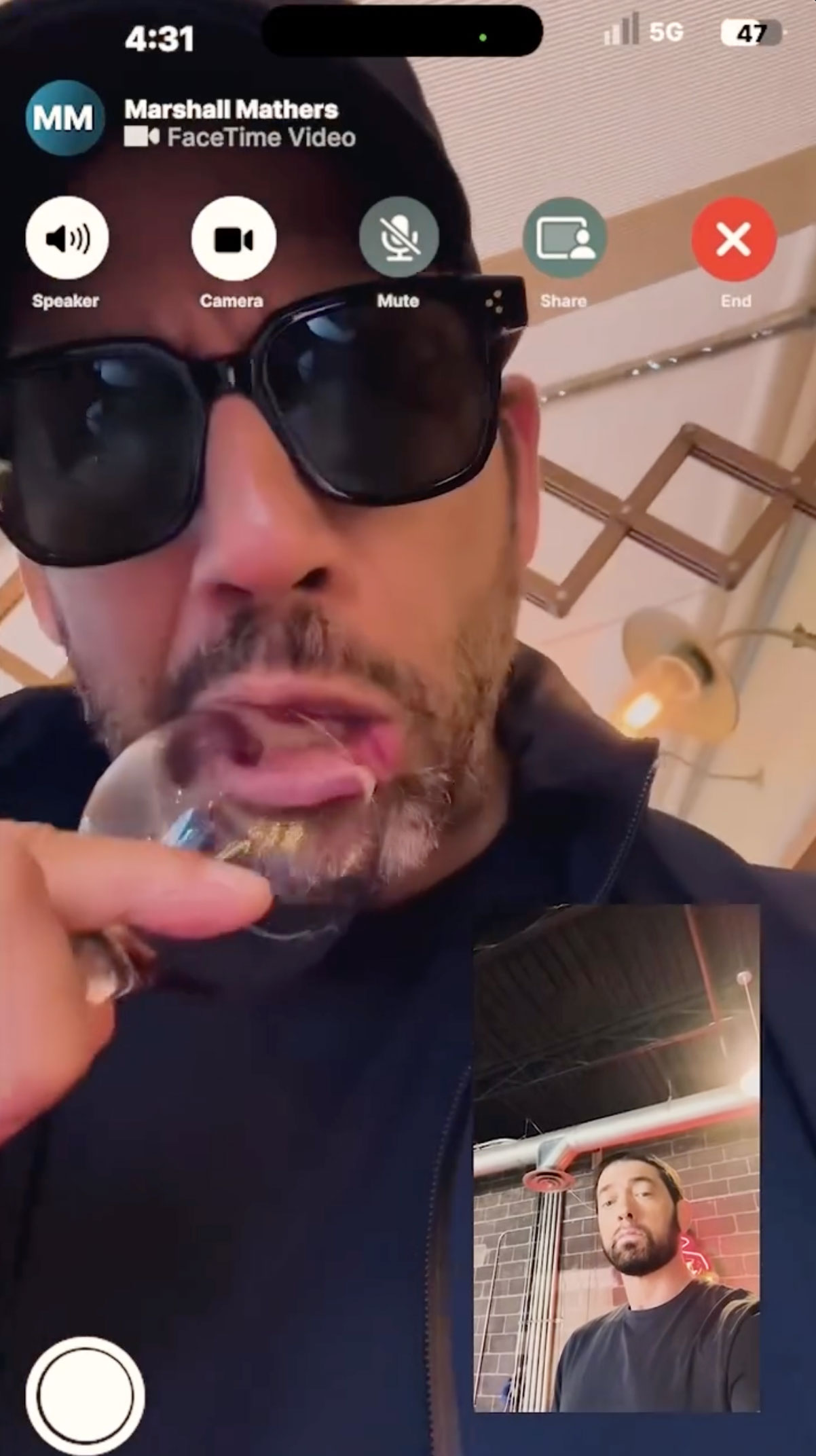 He FaceTimed David Blaine (pictured eating glass in the clip) to tease his upcoming album