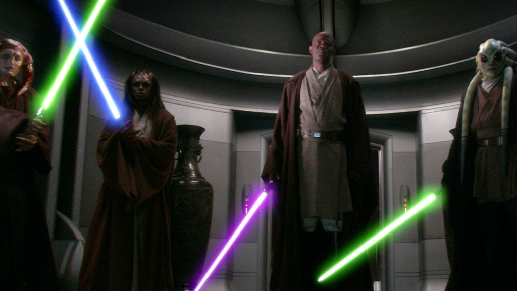 Four Jedi hold lightsabers of different colors in Star Wars