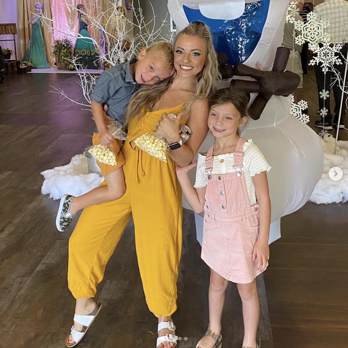 Mackenzie McKee is pictured with two of her children