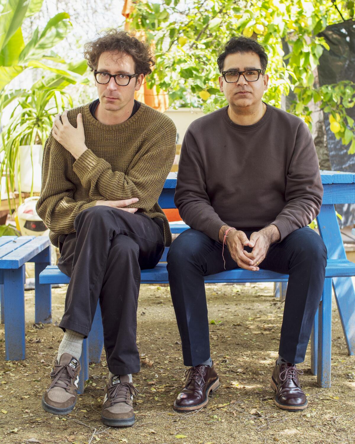 Two men sitting on a bench