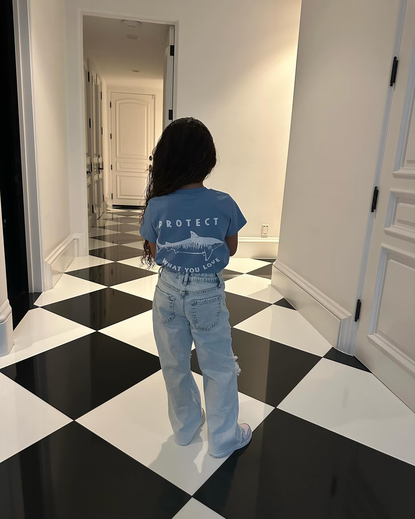 Dream appeared to be modeling a T-shirt in her father's post