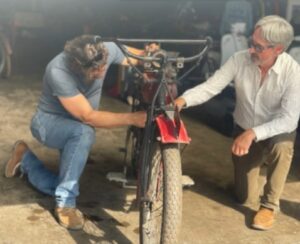 Jersey Jon Szalay posed with Mike Wolfe as they worked on a rare 1915 Indian Motorcycle