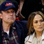 ben affleck and jennifer lopez looking miserable at a basketball game