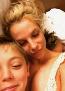 Britney Spears shared a rare throwback photo while cuddling her sons Sean and Preston in bed when they were young kids