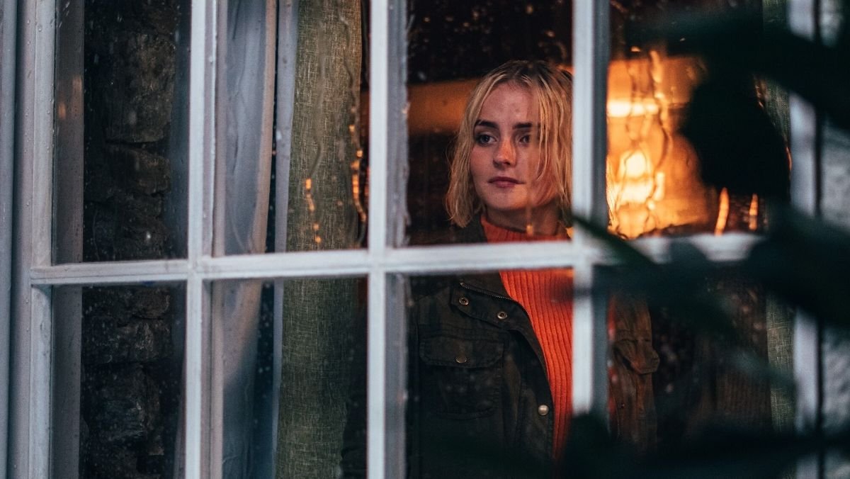 Ruby Sunday looks out of a window on a rainy day in 73 yards episode with kate lethbridge-stewart and UNIT