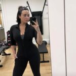 Demi Lovato showed off their curvy figure while posing in workout gear