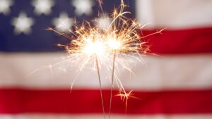 fireworks in front of American flag