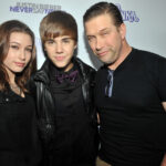 Justin and Hailey Bieber were photographed with her father, Stephen Baldwin (R), at the premiere of the Never Say Never documentary in 2011