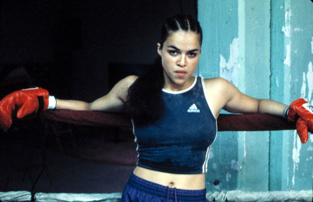 Michelle Rodriguez leaning against the edge of a boxing ring
