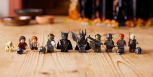 A line of Lego minifigs from Lord of the Rings, including Gollum, Frodo, Sam, Sauron, and various orcs
