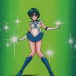 Sailor Mercury posing dramatically in front of a green background studded with sparkling lights in Sailor Moon.