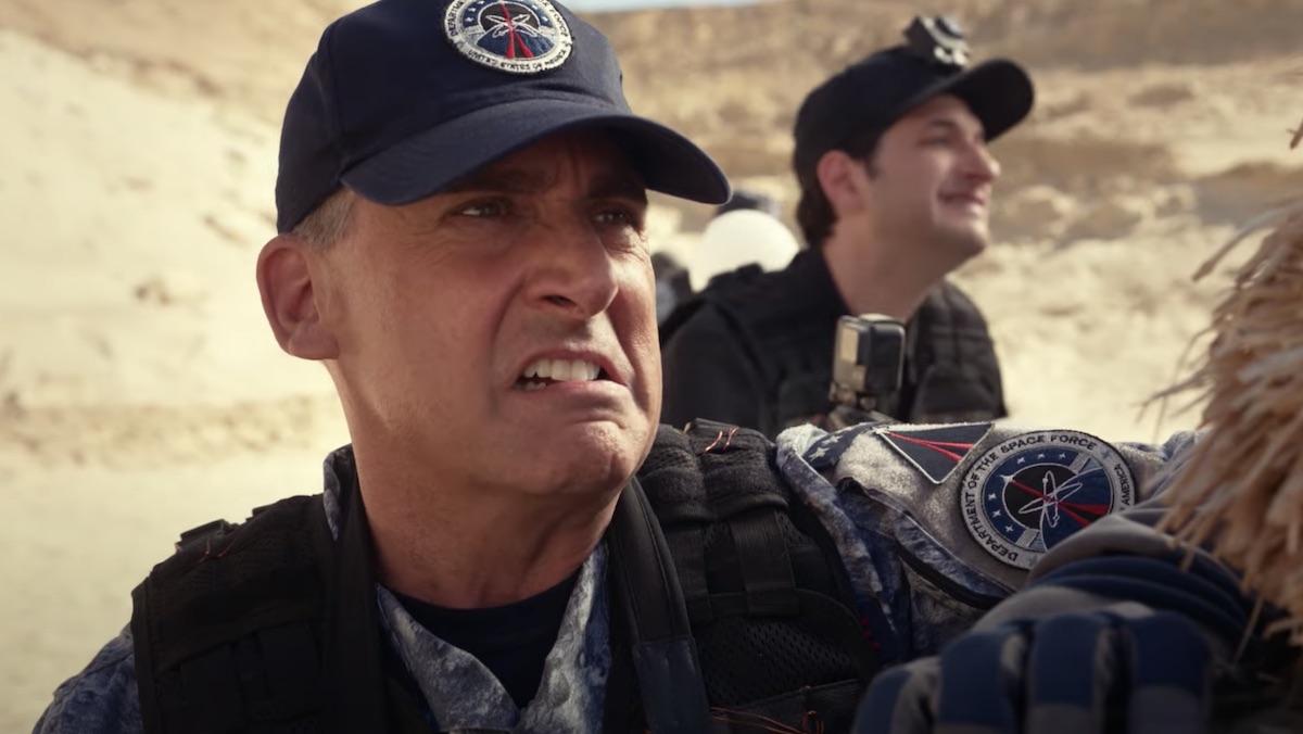 Steve Carell grimacing with a baseball hat on in Space Force