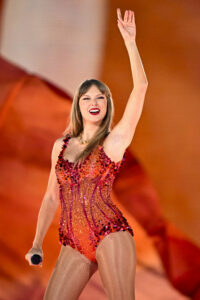 Taylor Swift emerged into a new Lover bodysuit during the first night of The Eras Tour in Paris, France, and fans think it's a nod to her boyfriend, Travis Kelce