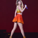 Taylor Swift wore Chiefs colors while on stage in Paris for the 87th Eras show