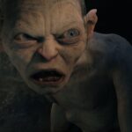 Gollum, half in shadow and half in light, snarls at hobbits in Lord of the Rings: The Two Towers