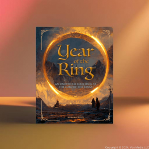 The cover of Year of the Ring by Susana Polo and Polygon contributors. A giant golden ring floats in the sky above adventures on a journey at twilight.